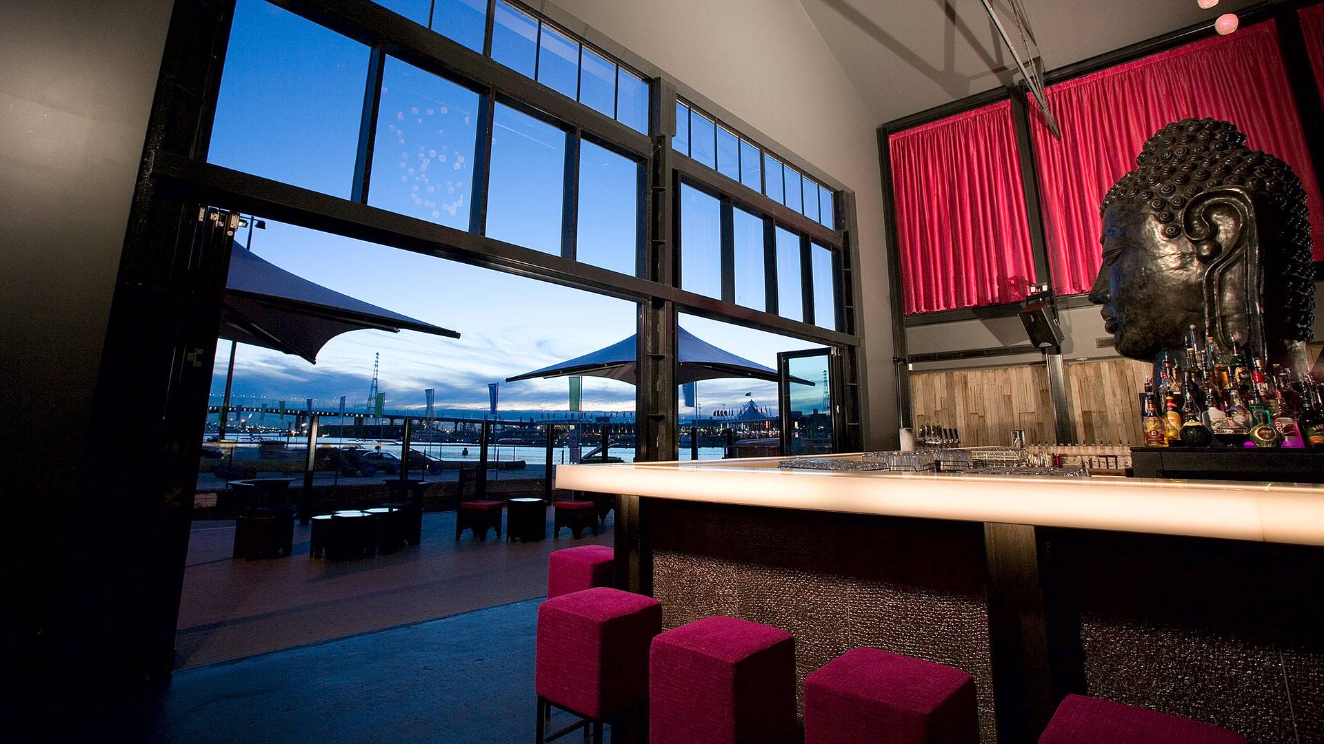 ELS Downlights were used to up-light the Buddha feature wall in the main room, casting coloured shadows over the bronze crevices. Square and round DMX panels were used in the bar tables.