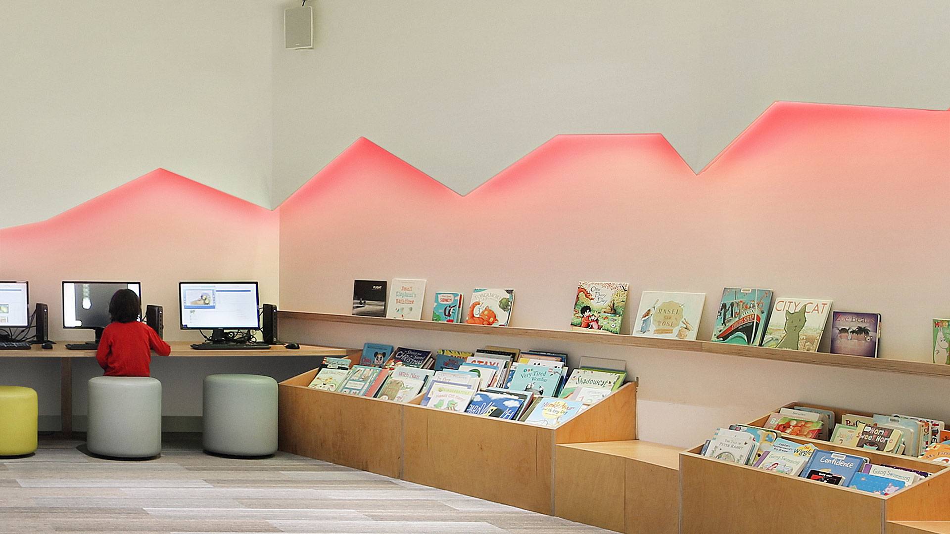 The colour changing Spectrum RGB strip illuminates a feature wall, creating an appealing and whimsical space.