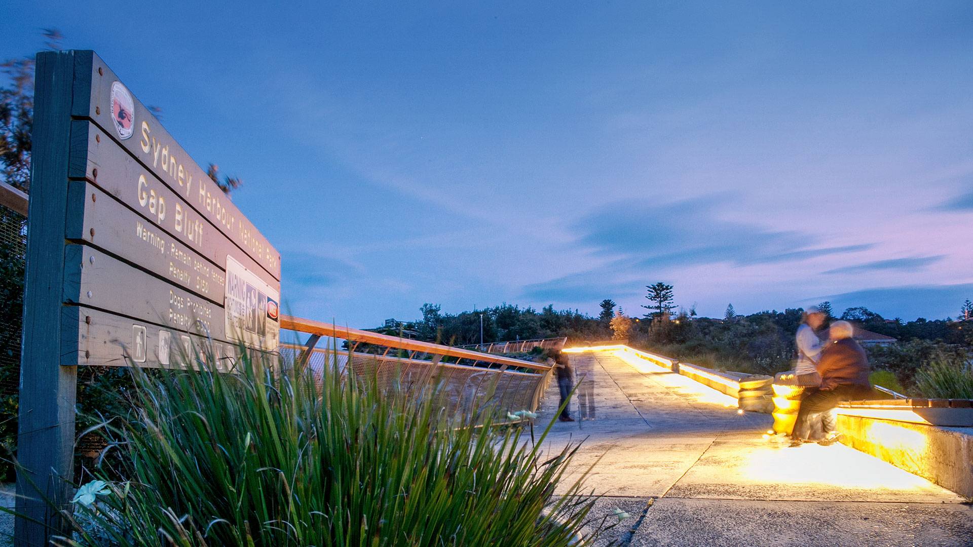 Gap Park in Watsons Bay, NSW features an installation of side-emitting strip lighting to create a continuous warm white glow under the bench seating.