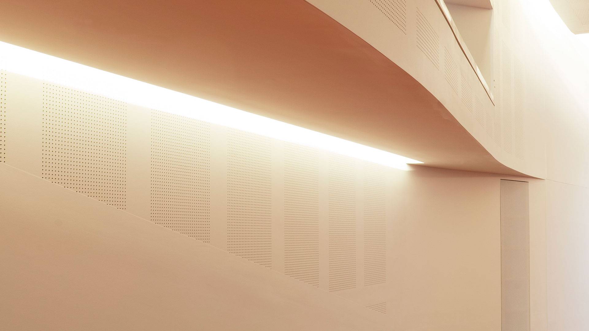 Primo X2 LED strip in application, installed in the Swinburne University AMC Building Lecture Theatre. Multiple soffits create a wave-like effect and double as an indirect lighting source.