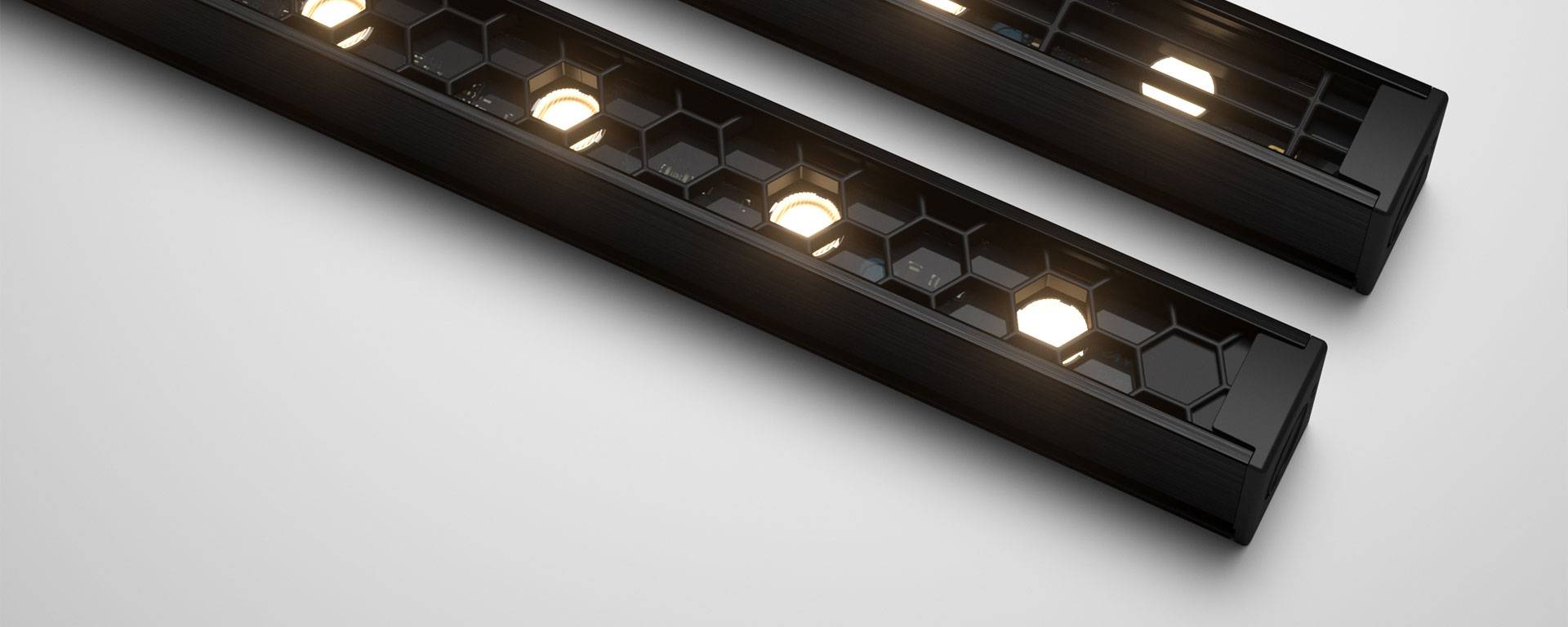 Ratio, with precisely detailed louvres that integrate perfectly with the optics. Available in Honeycomb Louvre, providing glare control in all directions, or Longitudinal Louvre, ideal where the main viewing angle is from the side.