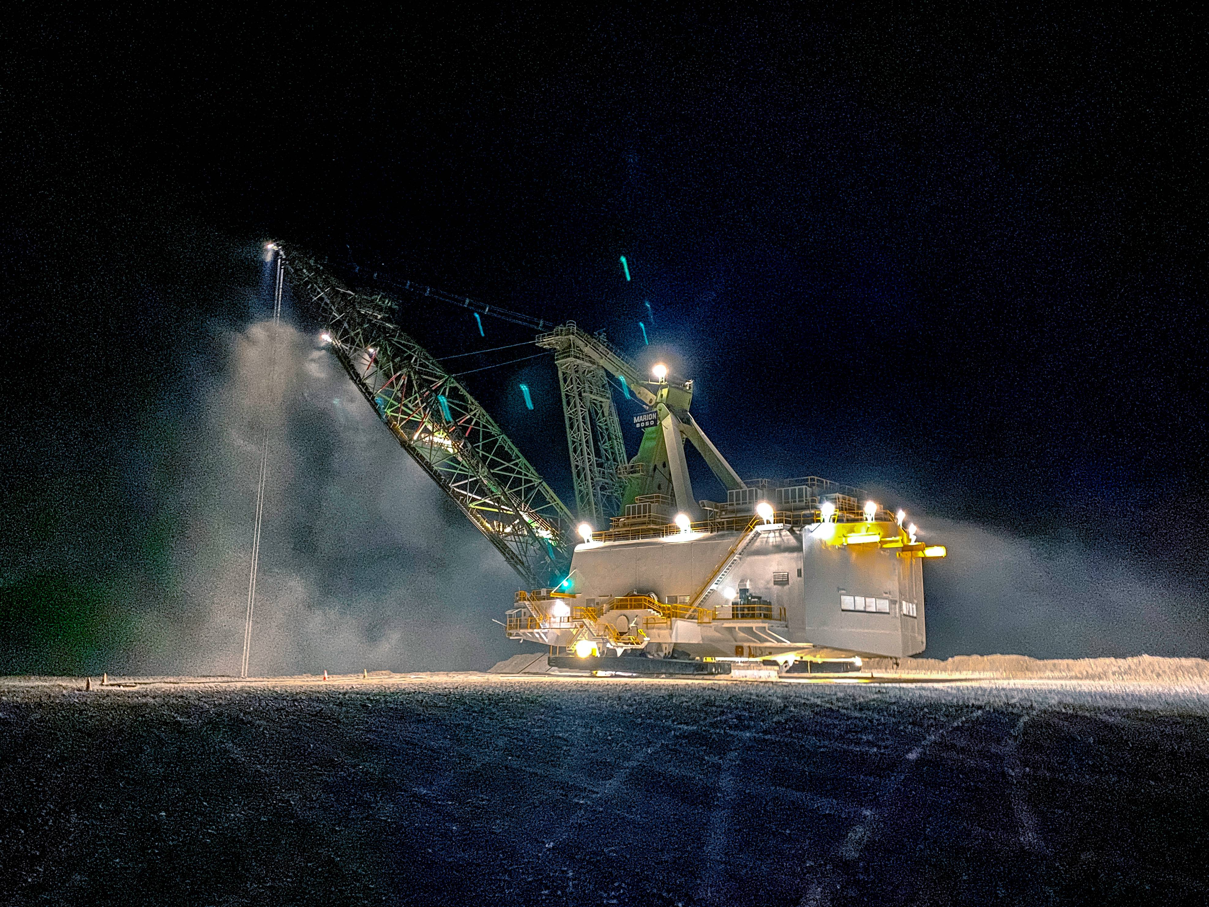 Marion 8050 dragline working at night, lit up with Coolon XBlades.