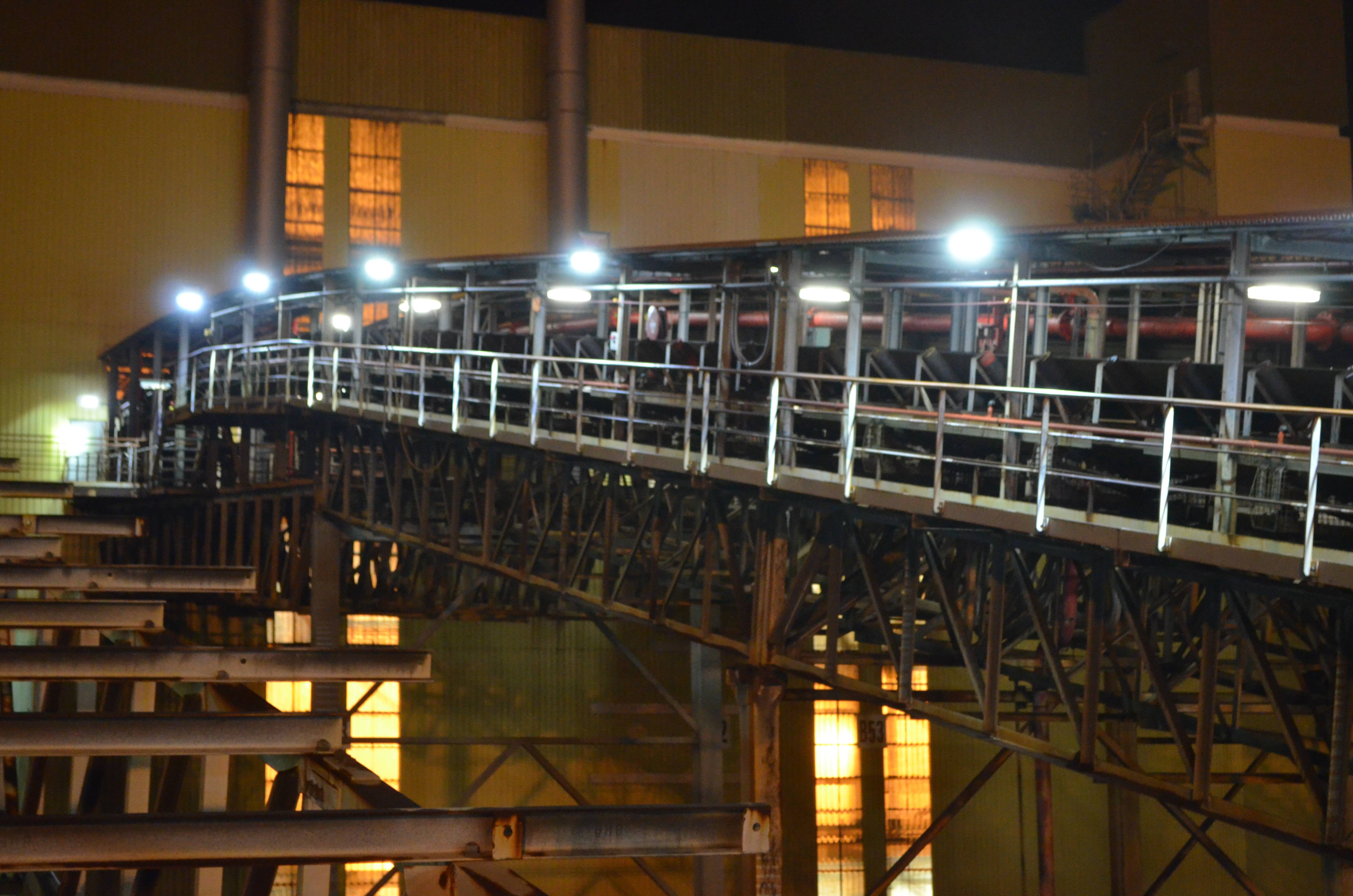 An industrial conveyor on a power plant is lit up with Coolon DLK2s.
