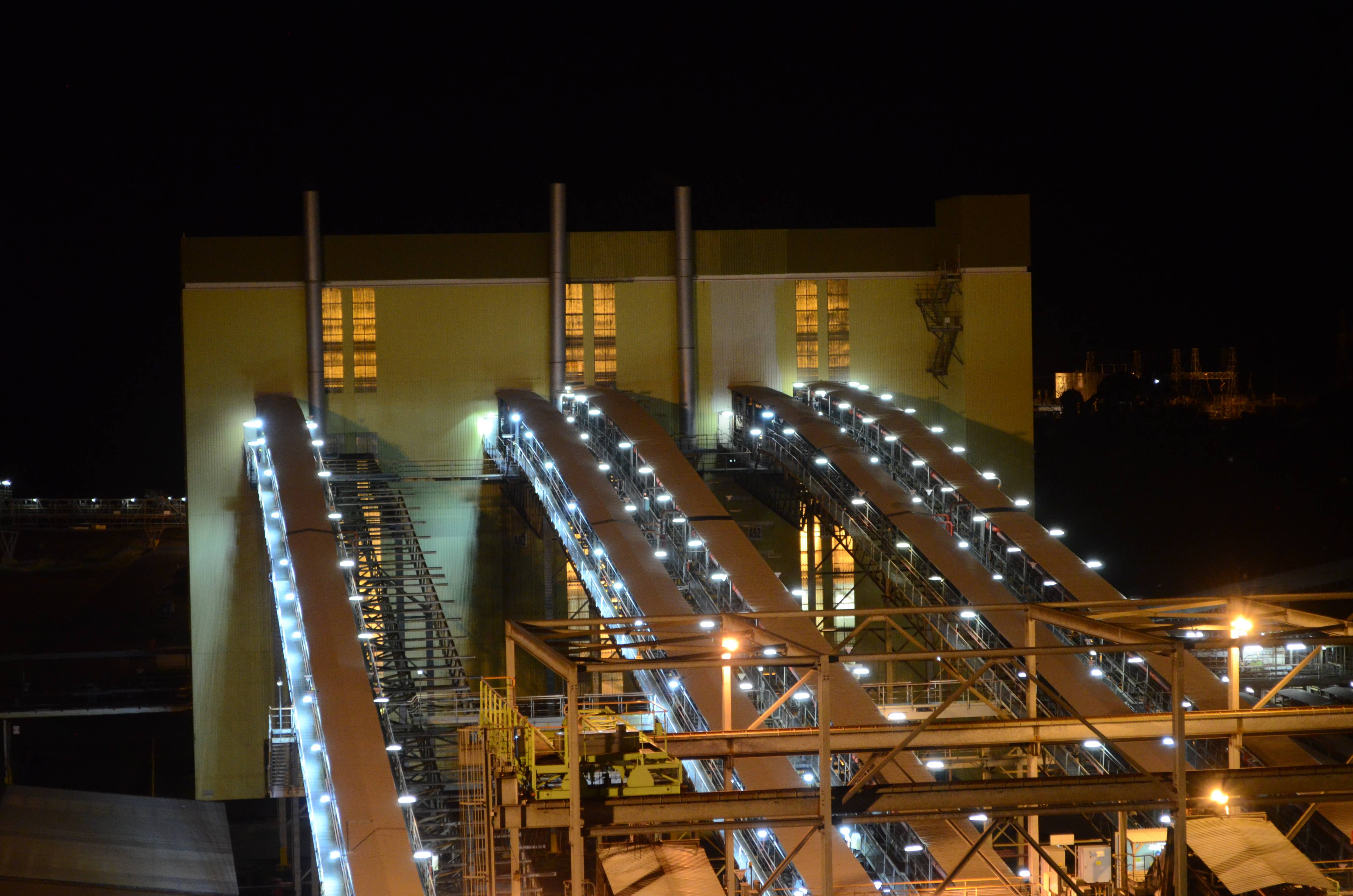 An industrial conveyor on a power plant is lit up with Coolon DLK2s.