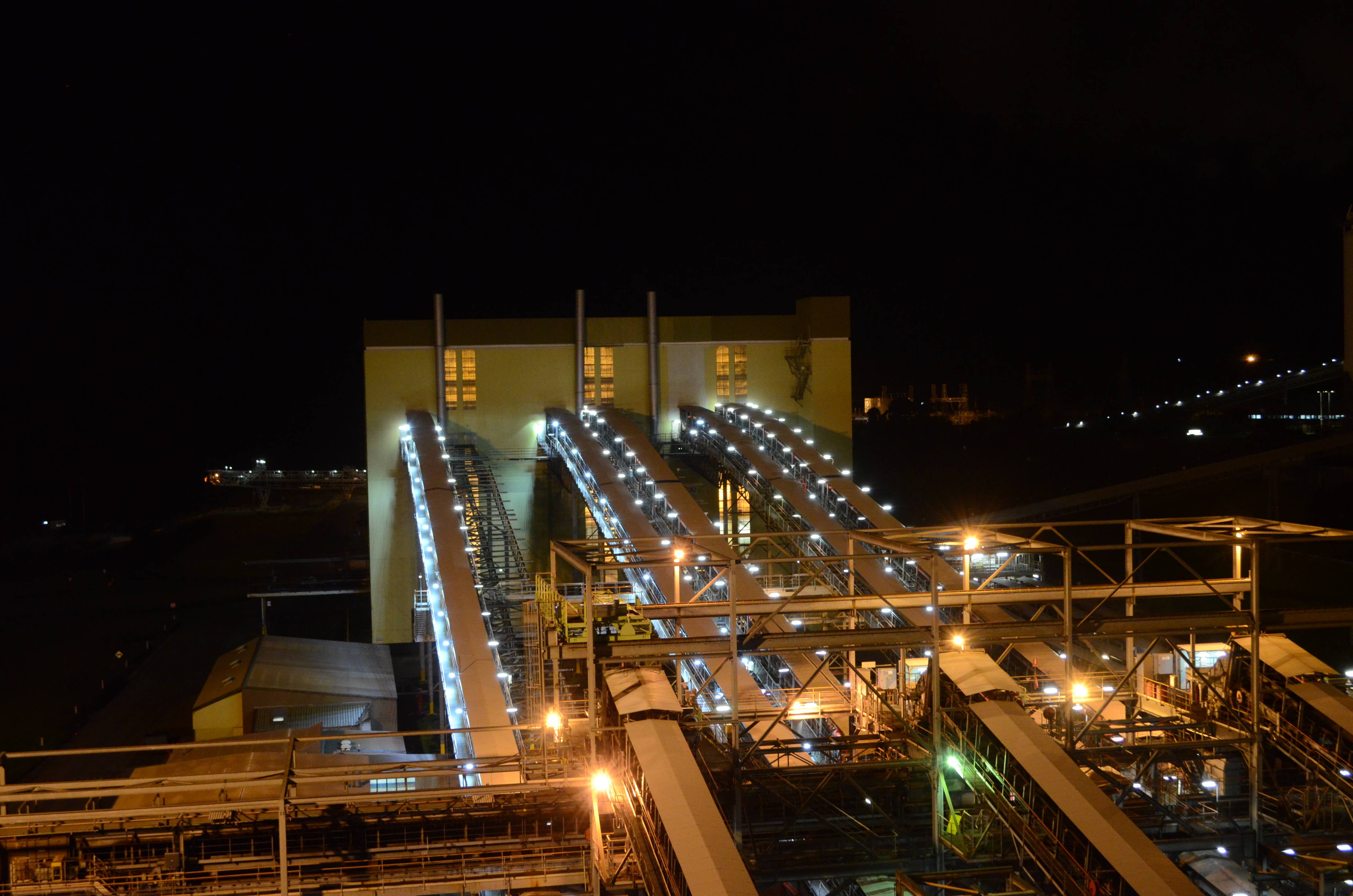 An industrial conveyor on a power plant is lit up with Coolon DLK2s.