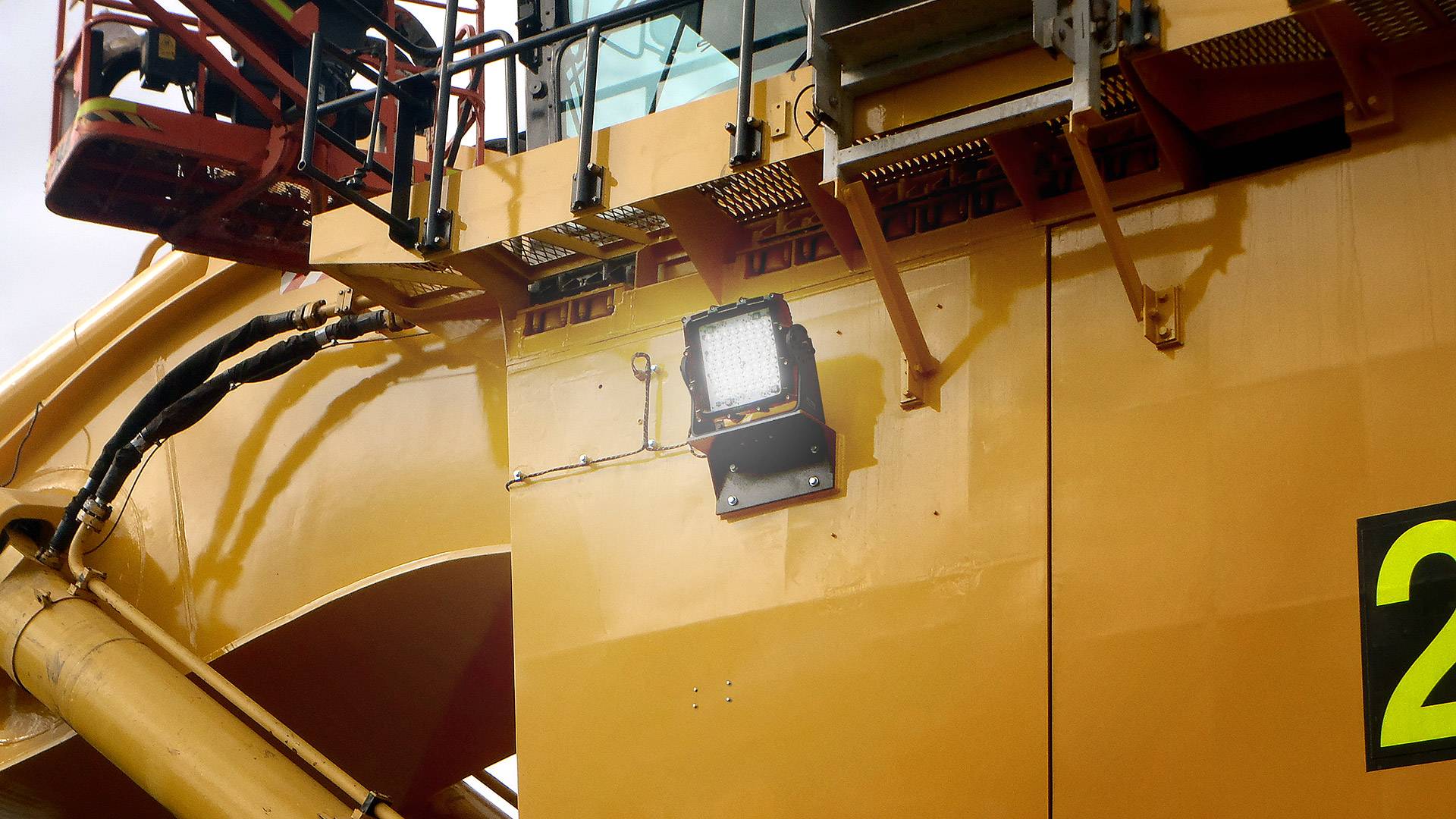 CP56 LED Flood Light in application, installed on a large hydraulic excavator komatsu on an industrial / mine site