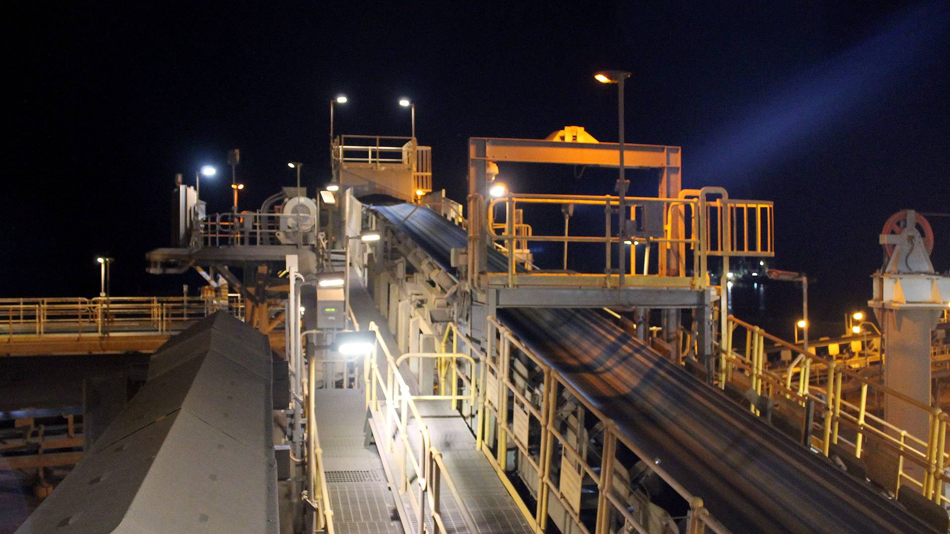 DLK2 LED Conveyor / Area Light in application, installed on a conveyor belt junction in a bulk port