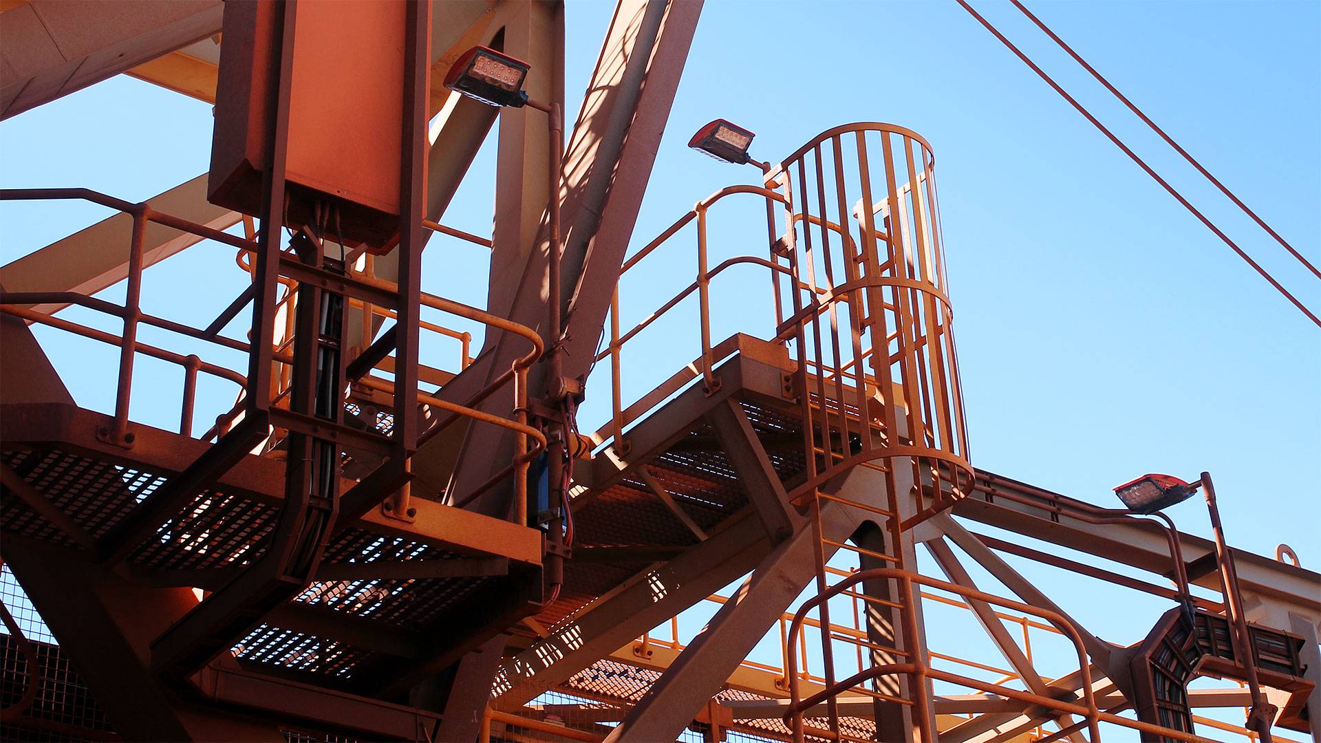 DLK LED Conveyor / Area Light in application, installed on a stacker reclaimer,  on stairwells and platforms